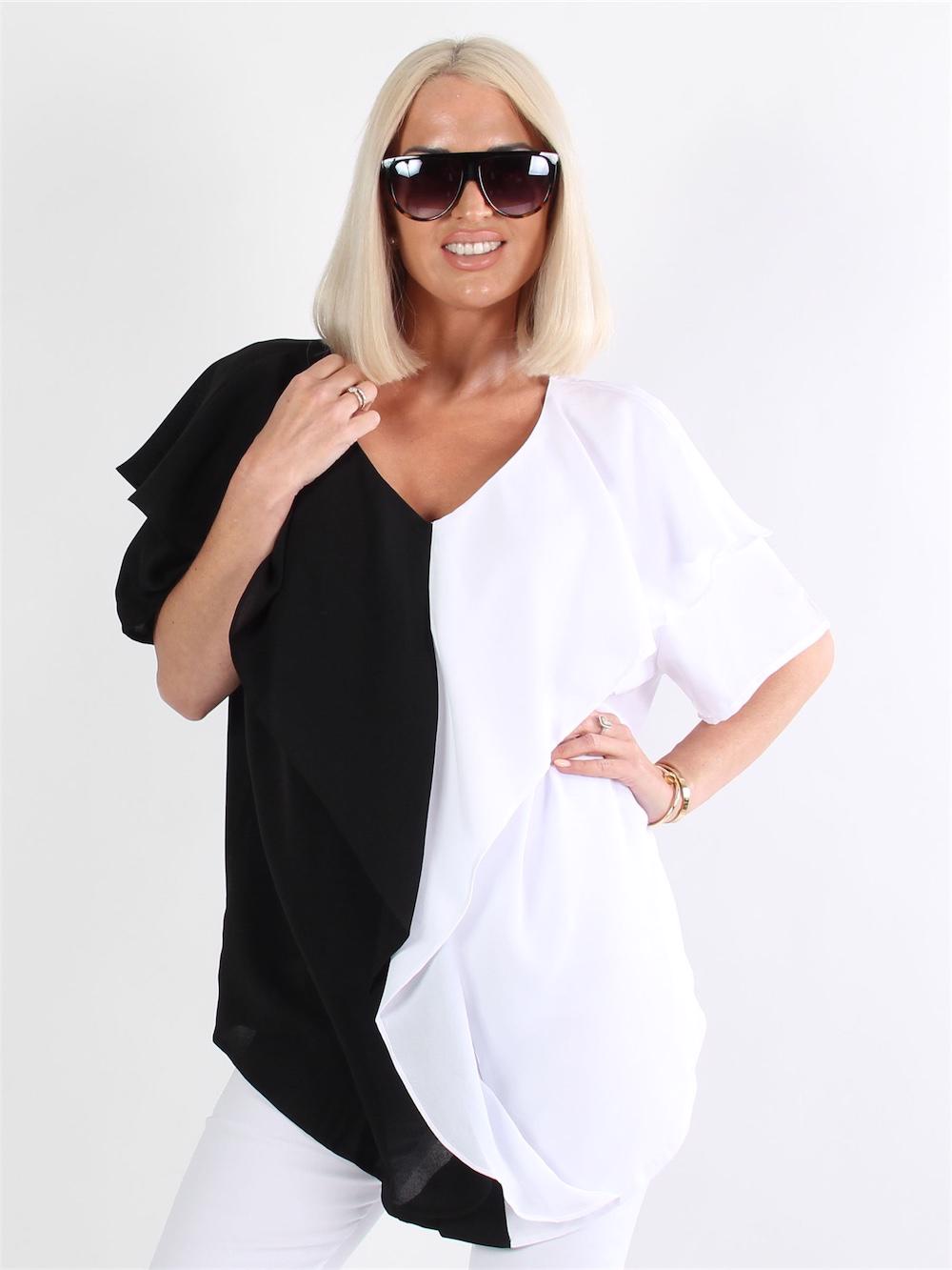 Arianna - Svart och vit blus med volanger
